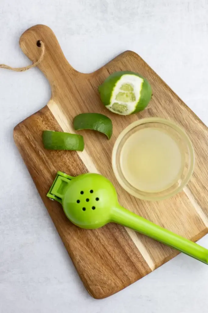 lime peels and juice for lion's tail cocktail garnish