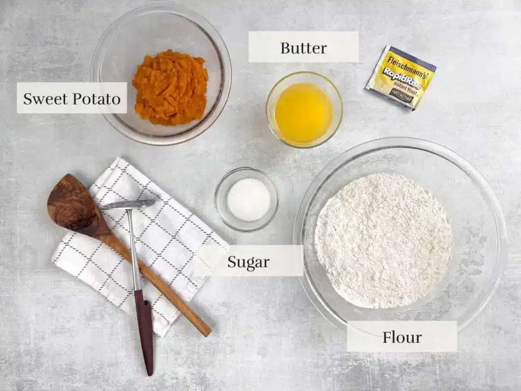 main ingredients for sweet potato rolls arranged on a surface in separate bowls