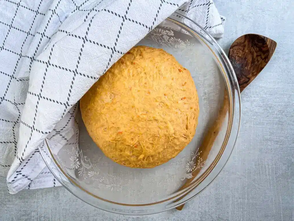 sweet potato roll dough that has risen in a covered bowl for 2 hours